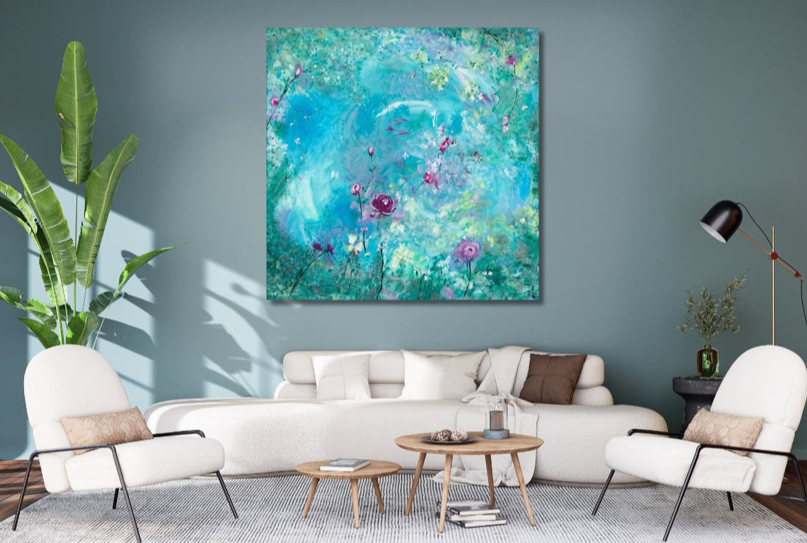 Living room with a large abstract painting on the wall, white sofa, and decorative items.