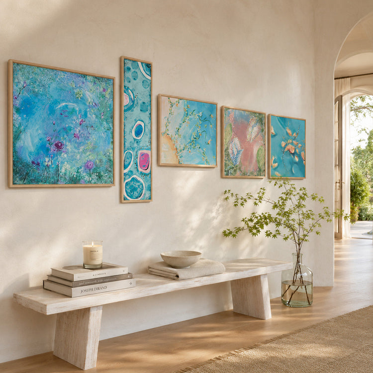 Abstract fine art prints displayed on a wall in a sunlit hallway