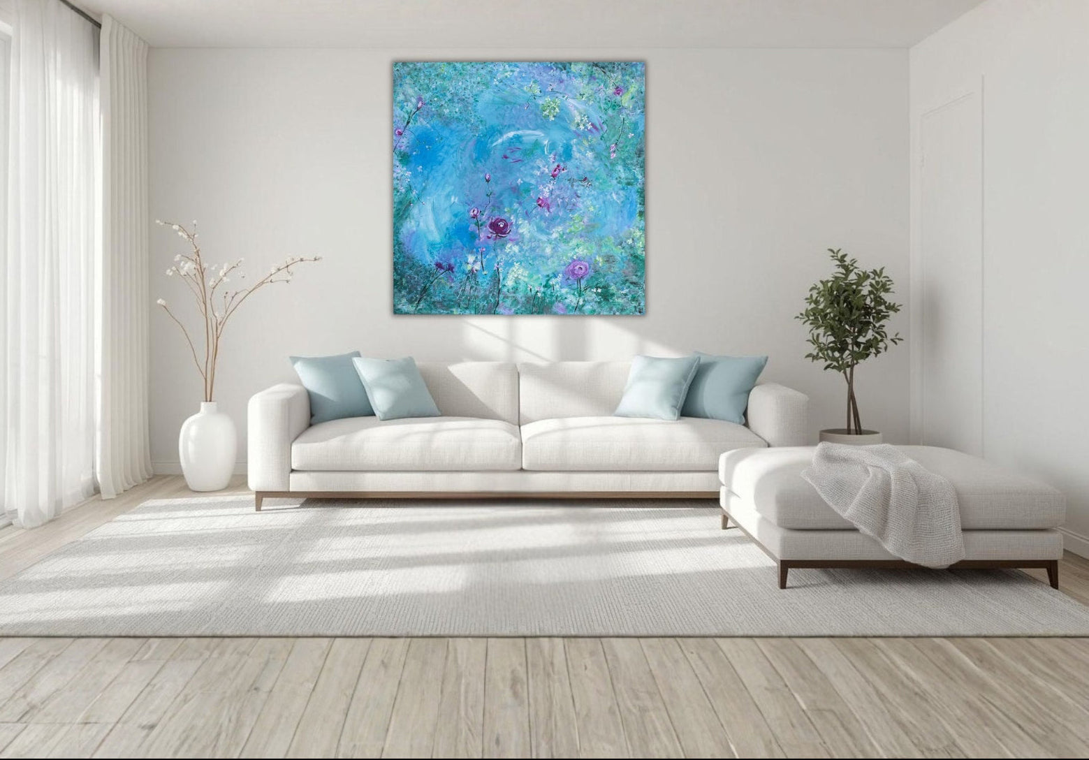 Modern living room with a white sofa, decorative pillows, and a large abstract painting on the wall.