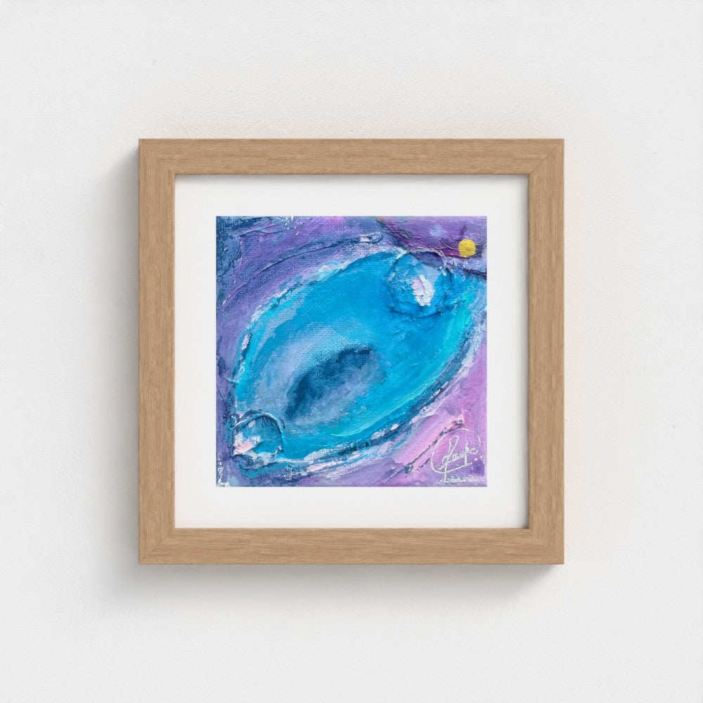 Framed abstract art print in an oak wood frame, swirling turquoise and violet tones with a single gold detail, part of the Enchanting Energy set.