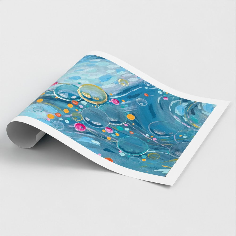 A rolled paper wall art print with an abstract blue and gold design featuring bubbles and colourful dots, shown on a light gray background.