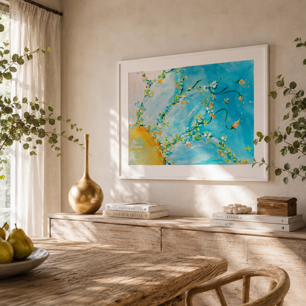 colourful floral art print framed on a wall in a sunlit dining room