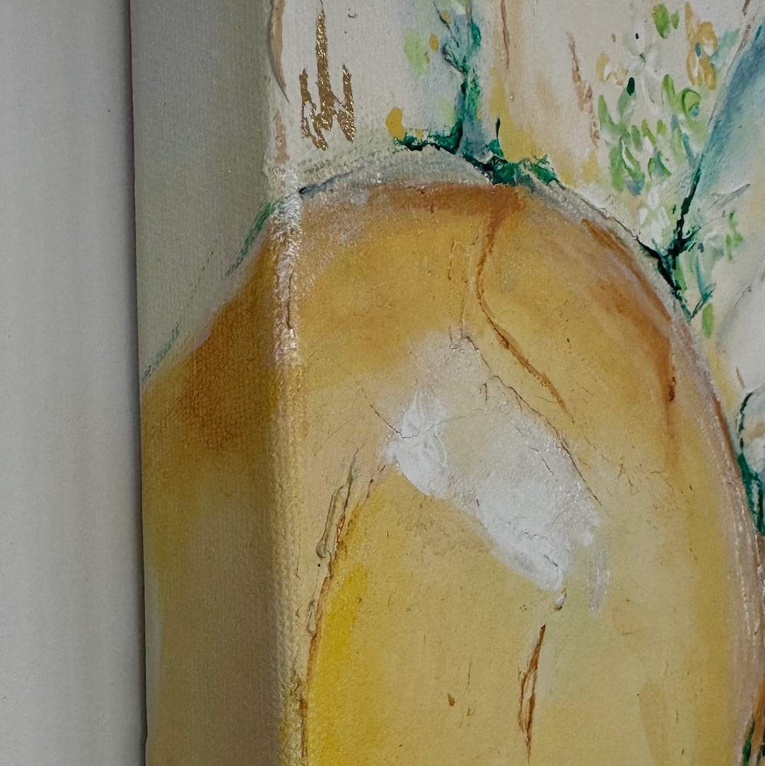 Close-up of a textured acrylic painting showing a warm yellow and beige circular form