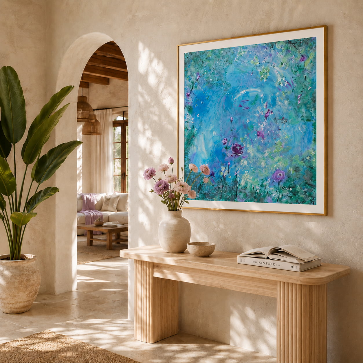 Floral artwork in blues pink and green in a sunny hallway of a mediterranean home
